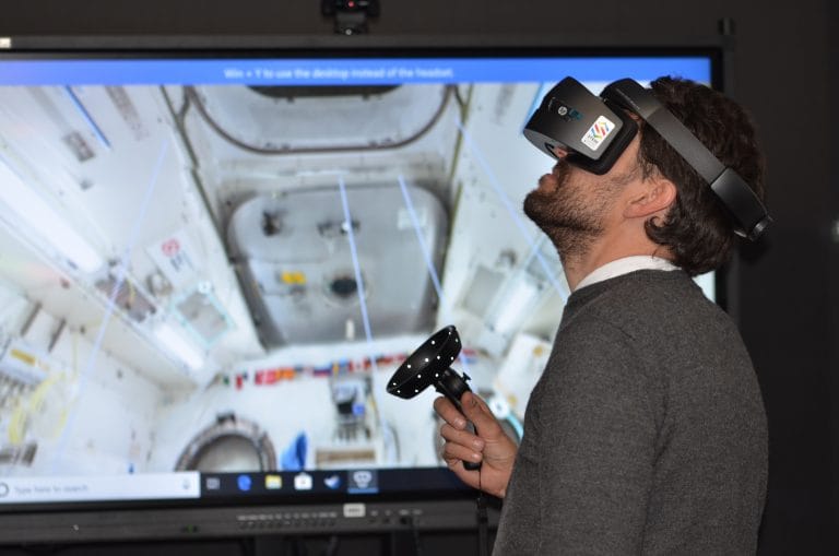 A man using VR headset for mixed reality experience