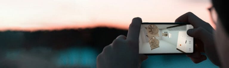 A man holding a camera with virtual reality