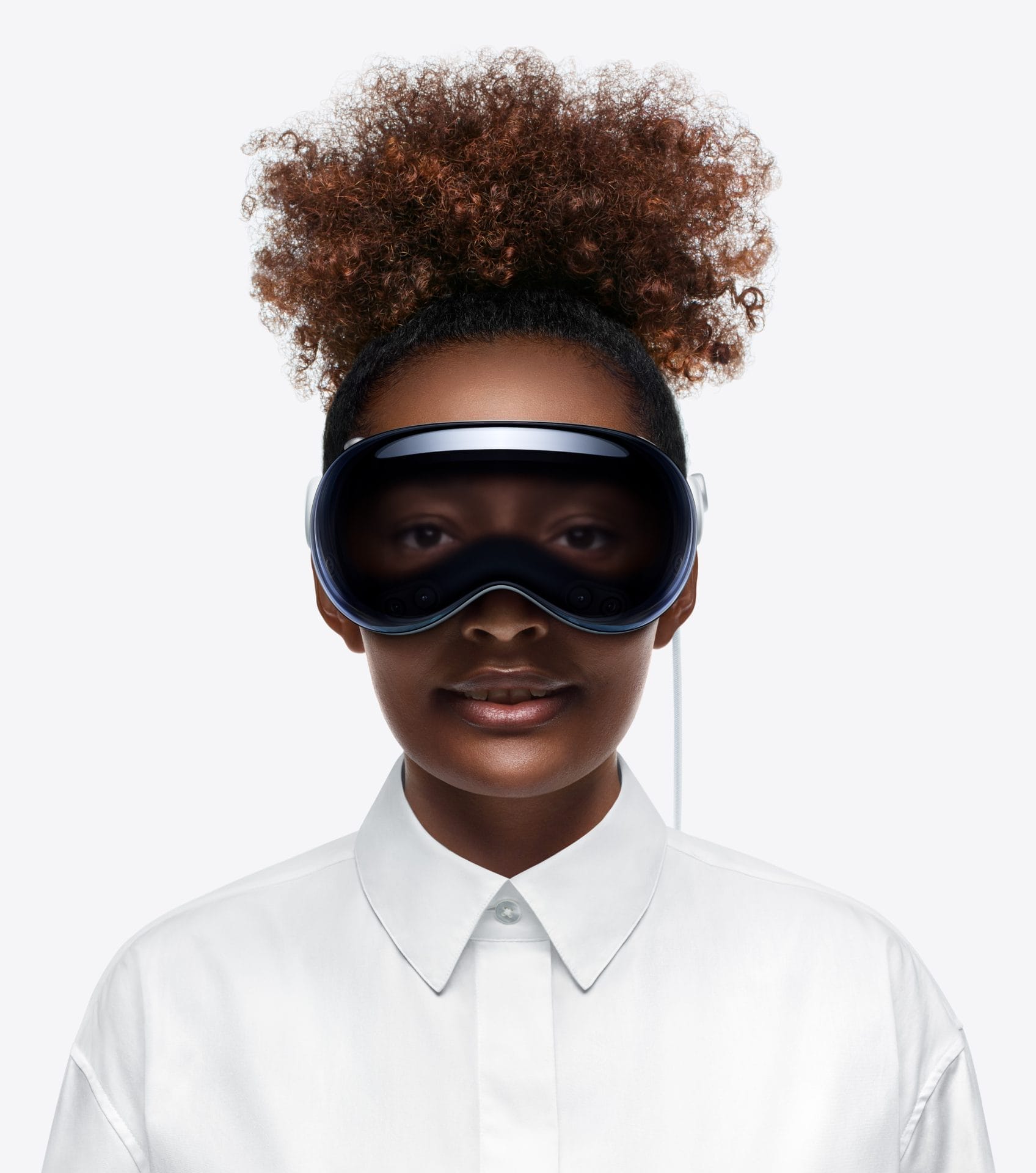 Young woman wearing apple vision pro headset, seen from the front